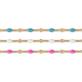 Gold filled chains with colorful enamel options on a white background