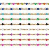 Colorful beaded chains on a white background