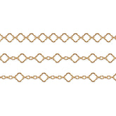 Gold filled clover chains on a white background