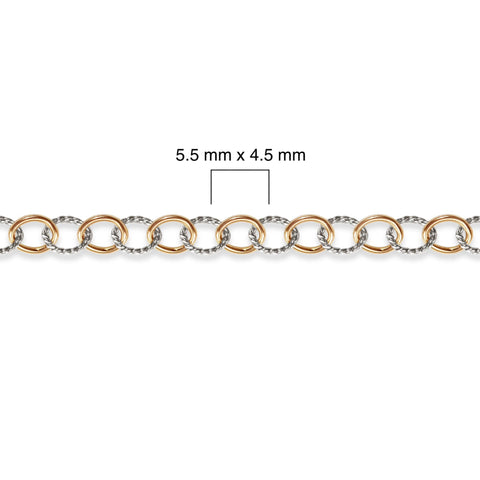 Close-up of a gold filled and silver chain with measurement details on a white background