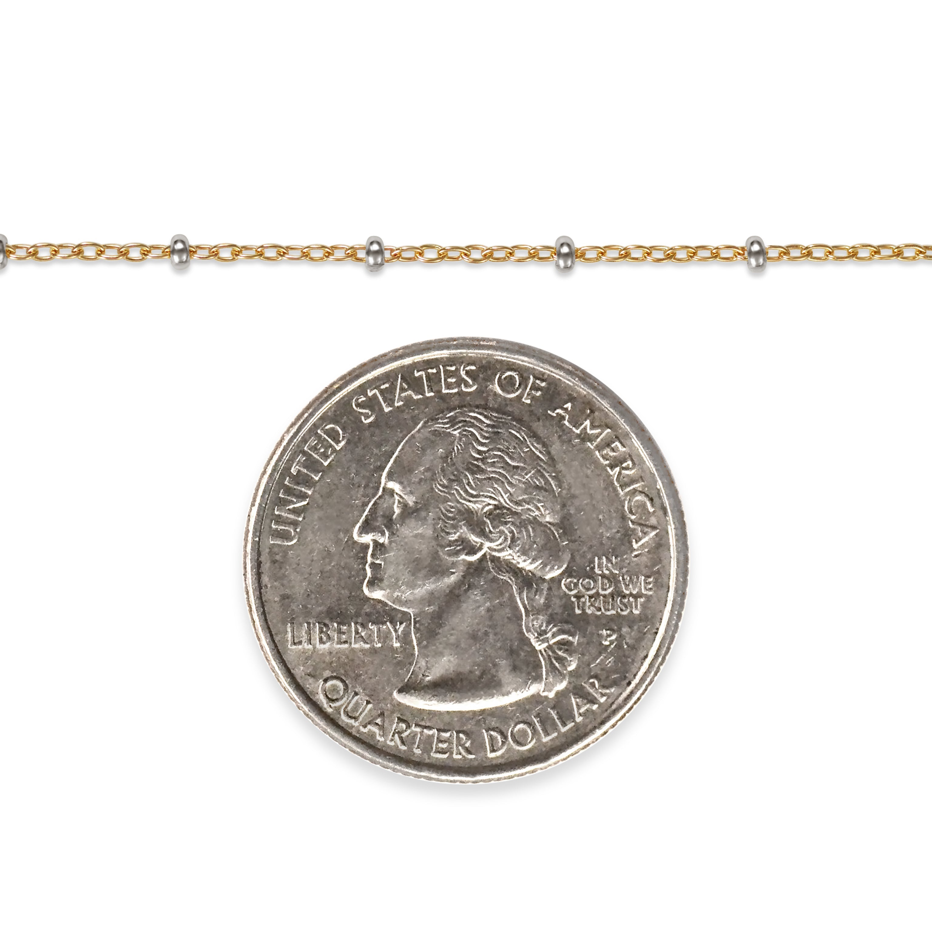 Gold filled chain with a quarter dollar coin on a white background