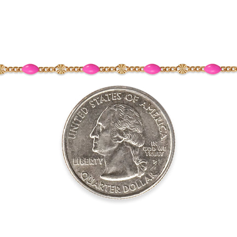 Gold filled chain with pink enamel next to a quarter on a white background