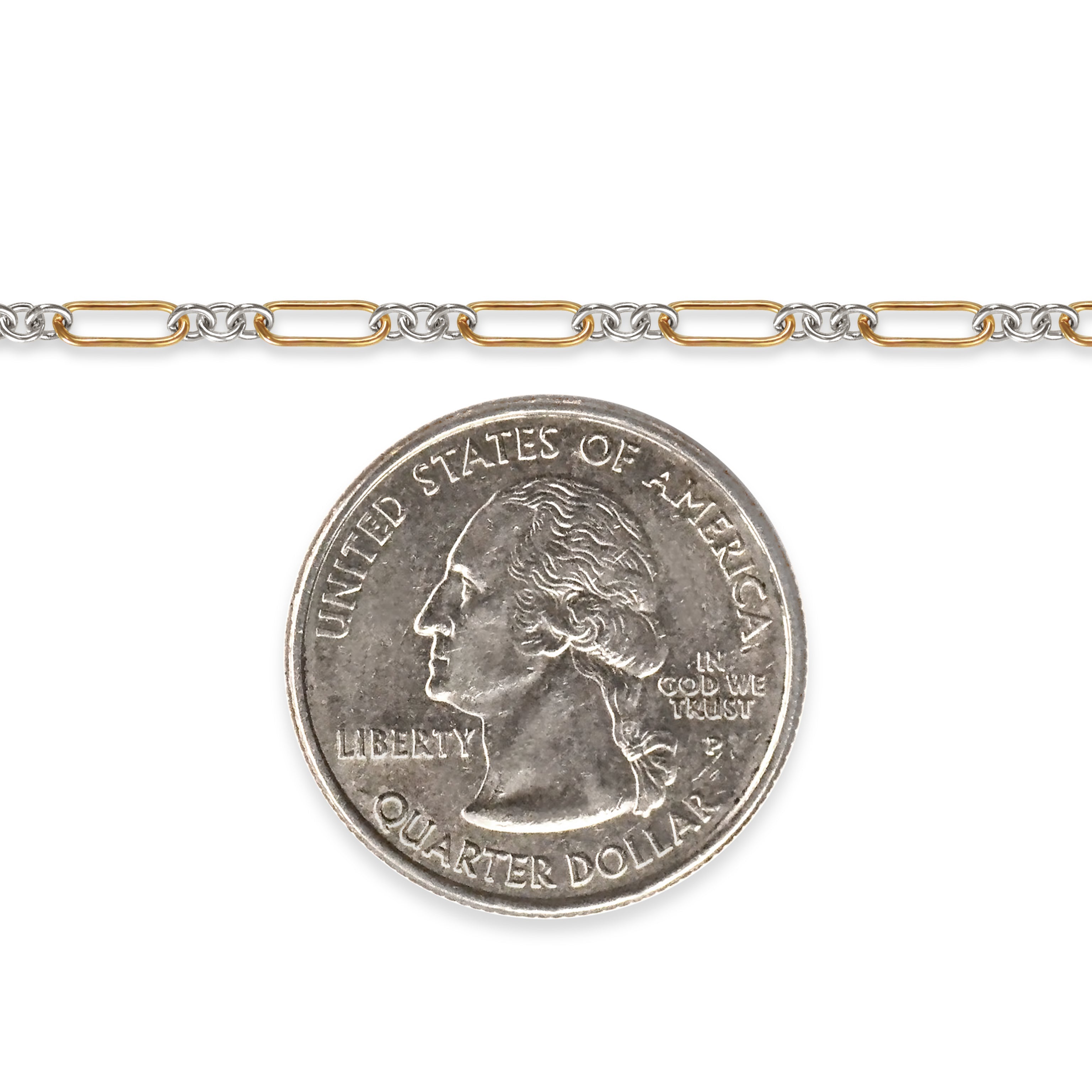 Two-tone chain next to a quarter on a white background