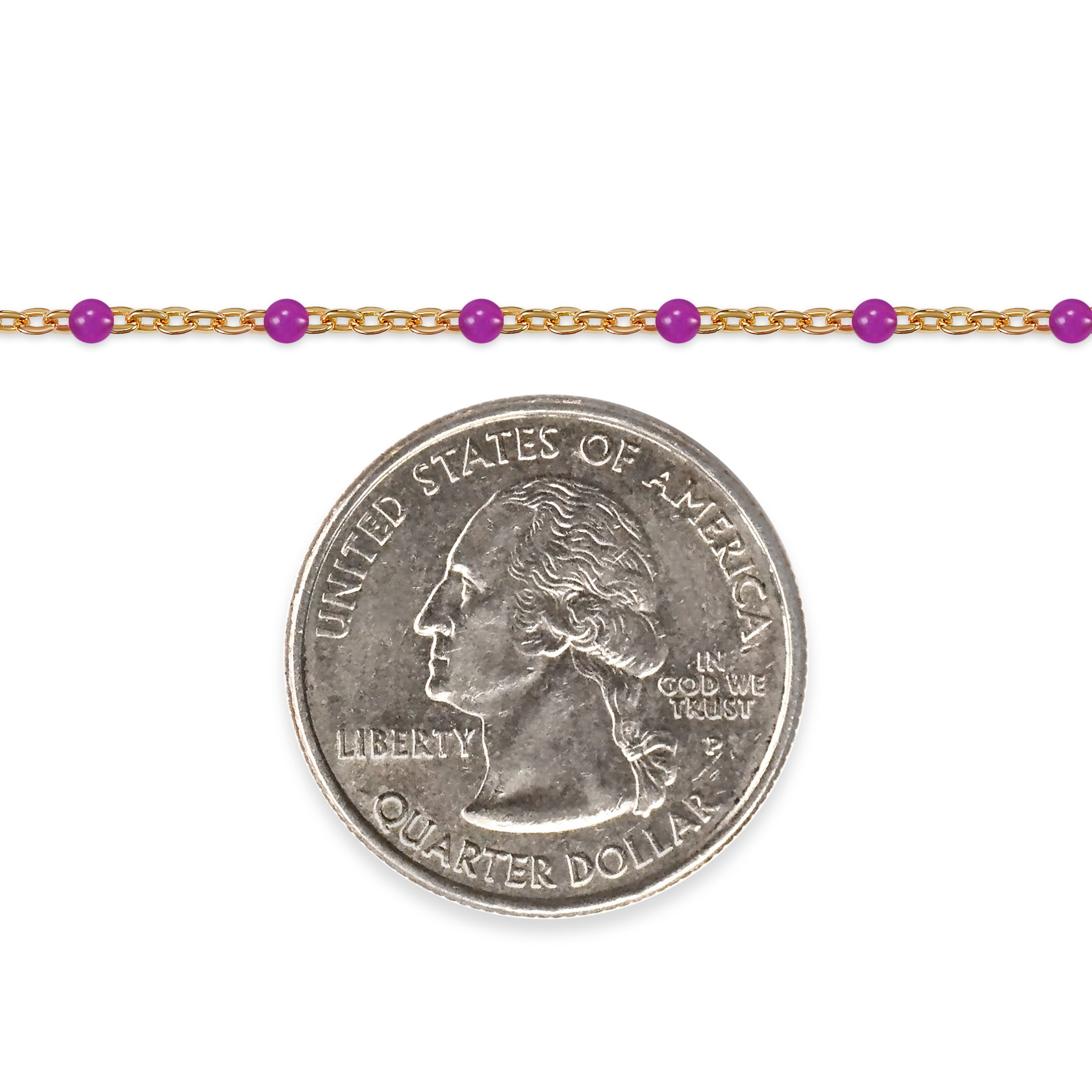 Gold chain with purple beads and a quarter dollar coin on a white background
