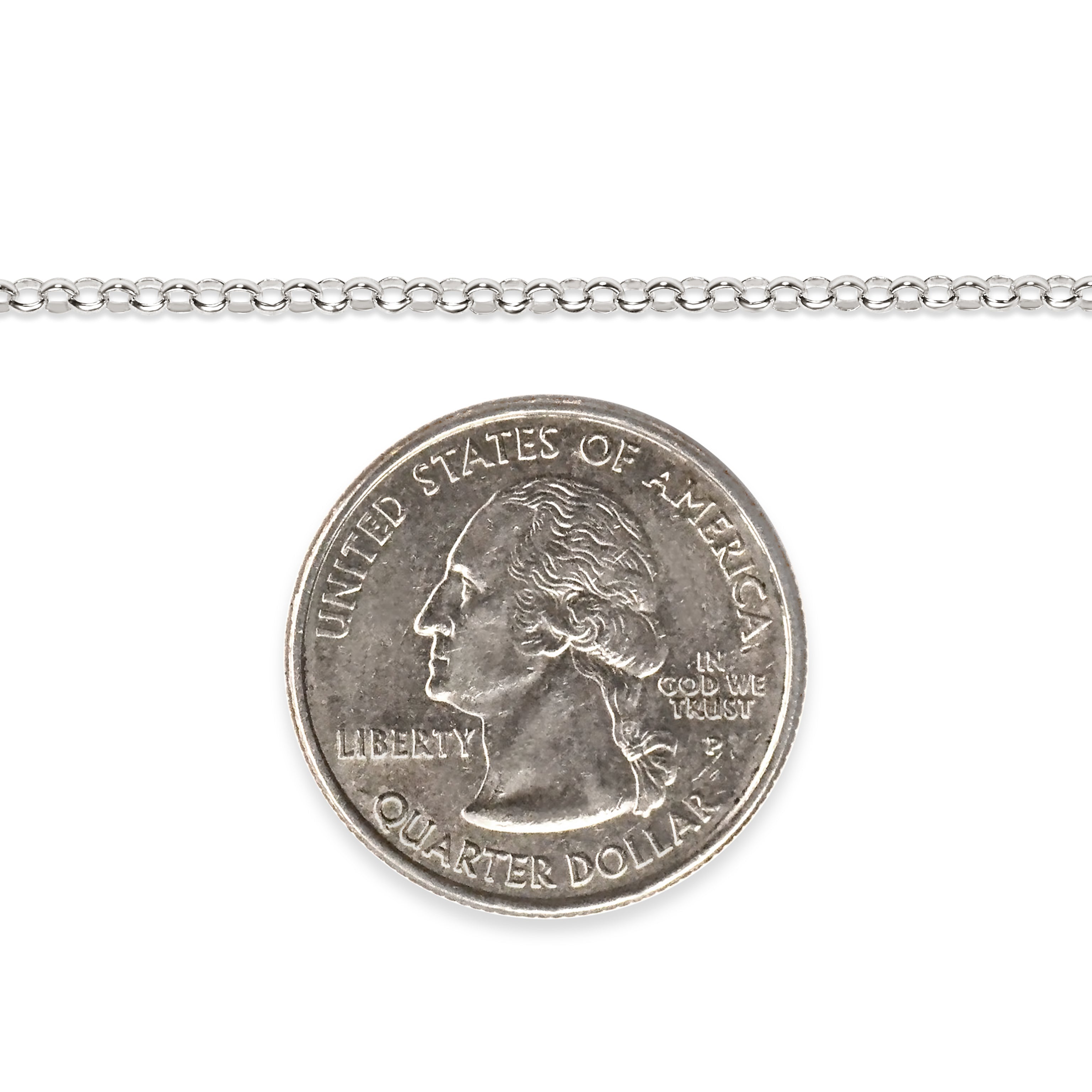 Silver chain next to a quarter dollar coin on a white background