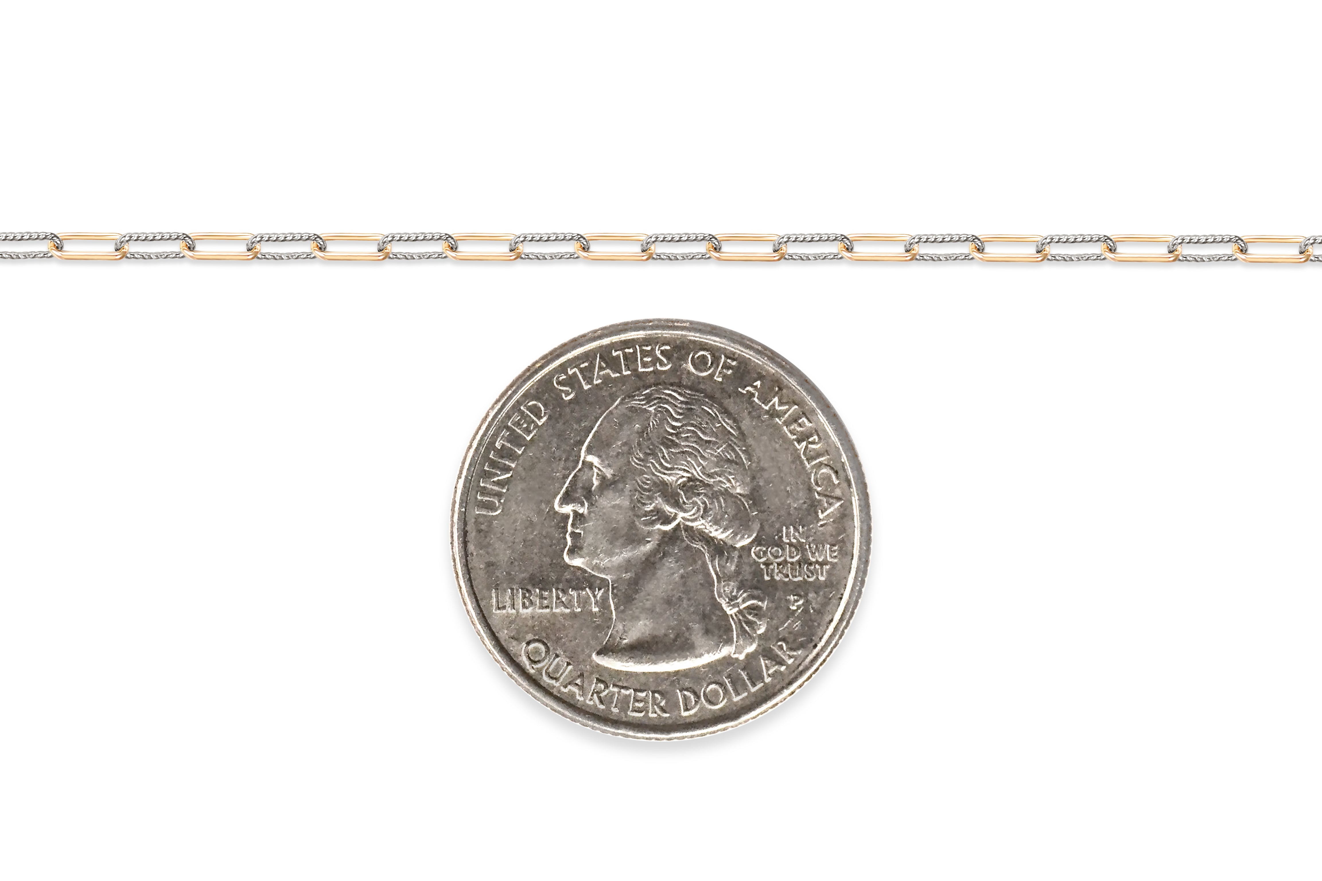 Two-tone gold-filled + sterling silver chain  on a white background next to a U.S. quarter dollar coin for scale 