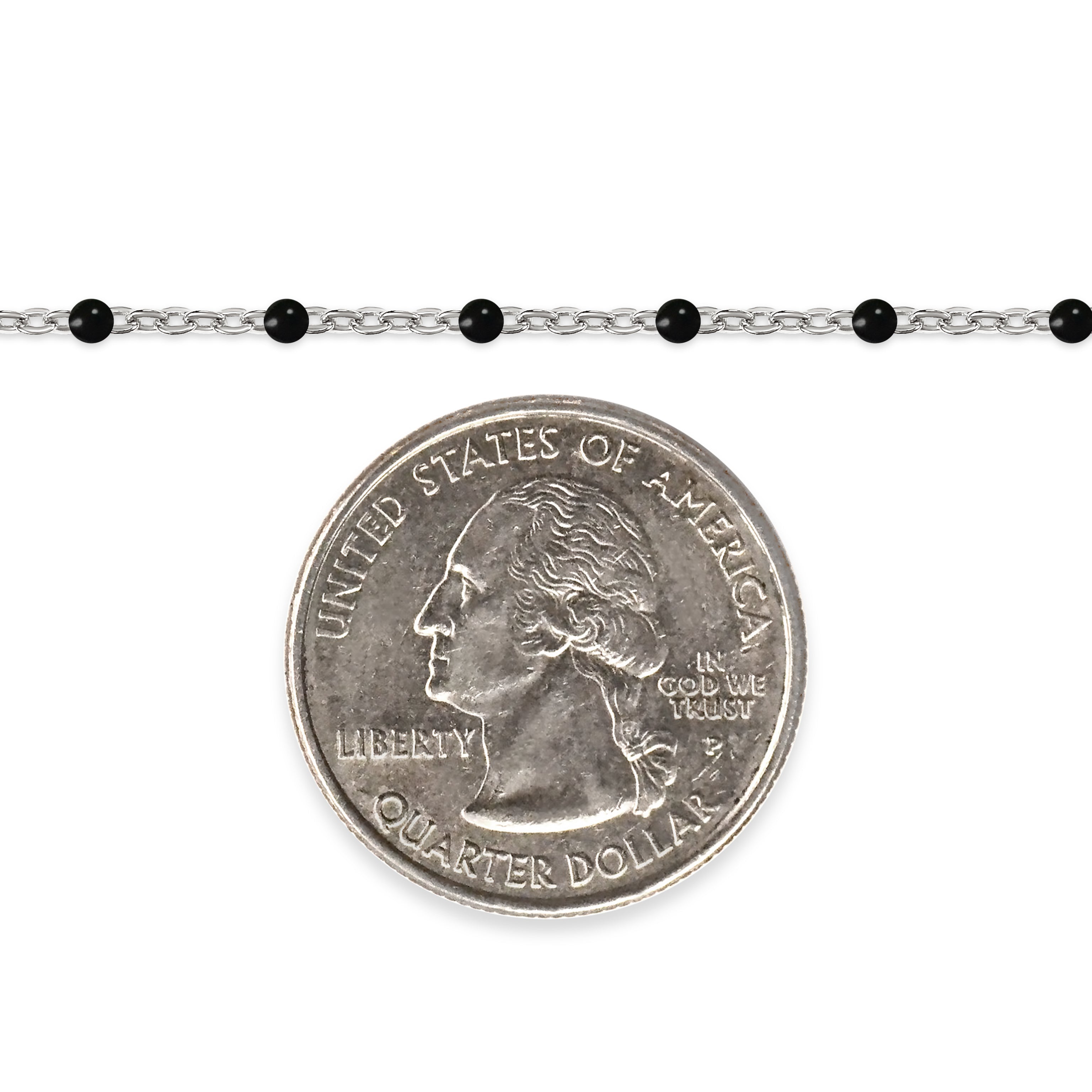 Silver chain with black enamel beads and a quarter dollar coin on a white background