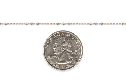 Gold-filled + sterling silver chain next to a U.S. quarter dollar coin for scale