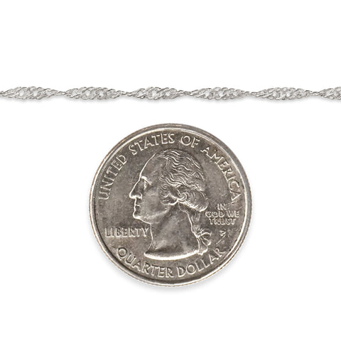 Silver singapore chain next to quarter dollar coin on a white background