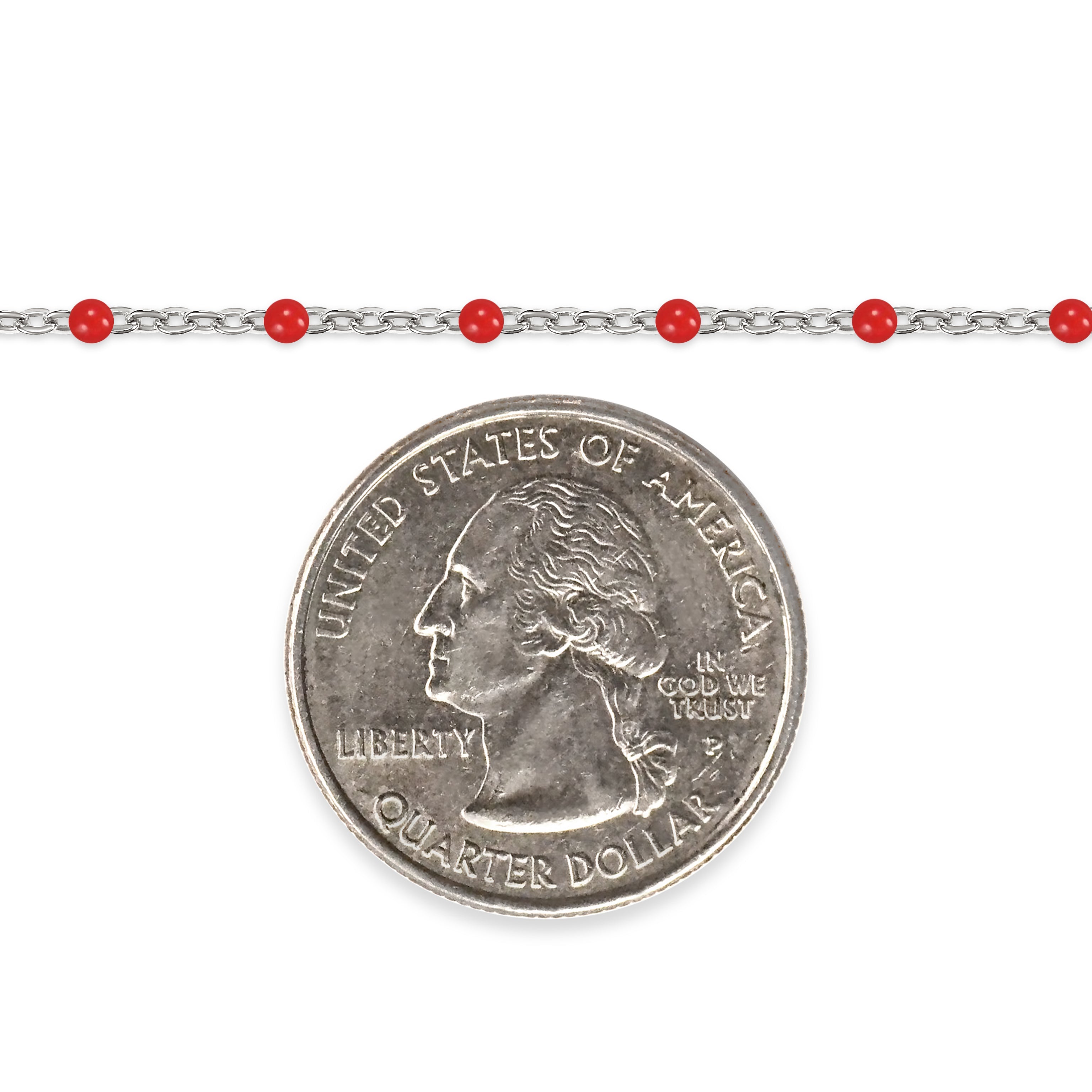 Silver chain with red enamel beads and a quarter dollar coin on a white background
