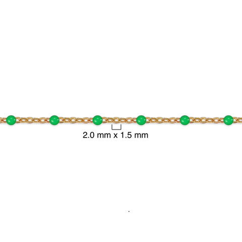 Gold chain with green beads on a white background