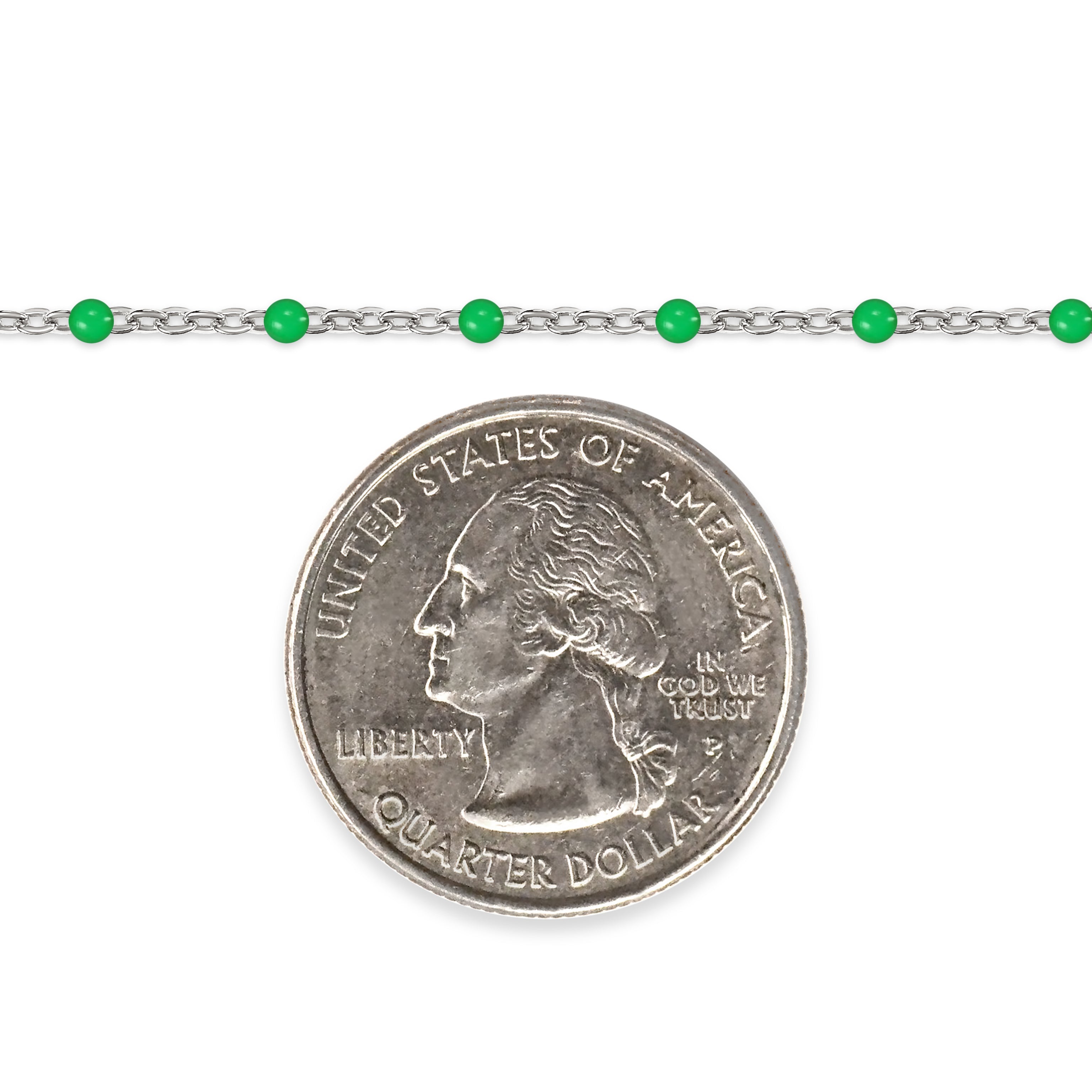 Silver chain with green enamel beads and a quarter on a white background