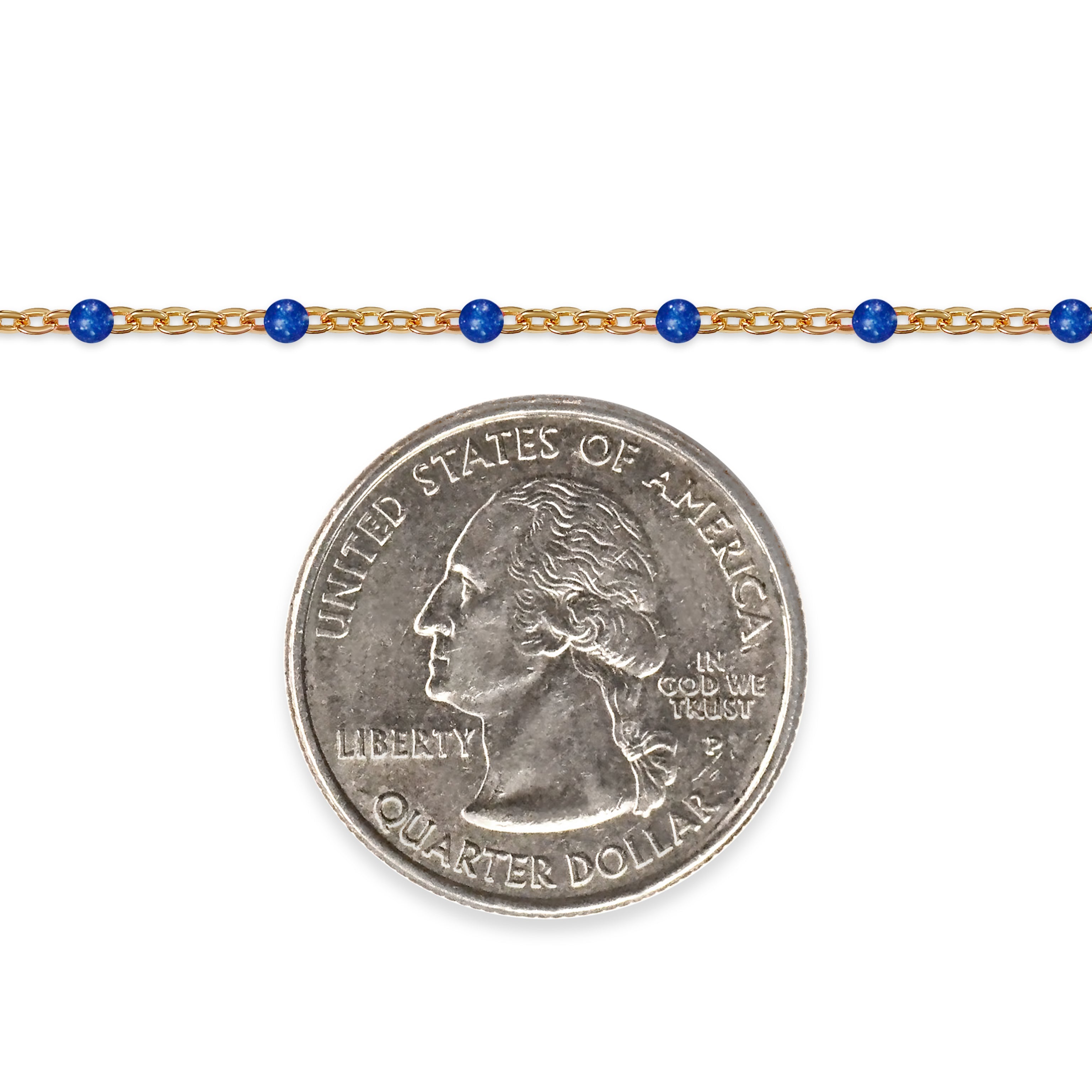 Gold chain with blue beads and a quarter dollar coin on a white background