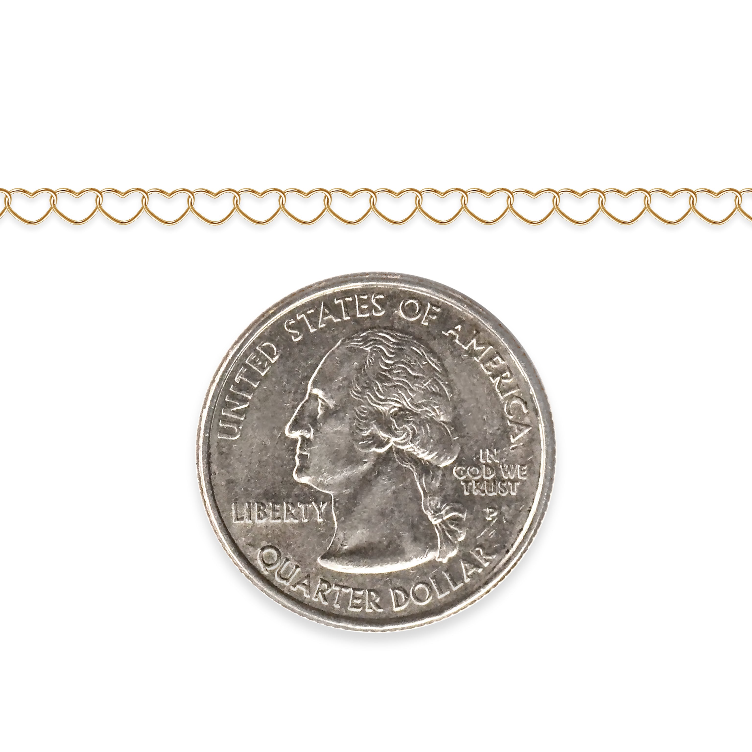 Gold-filled heart chain next to a quarter dollar coin on a white background