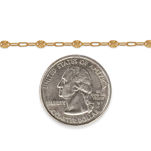Gold chain with a quarter dollar coin on a white background
