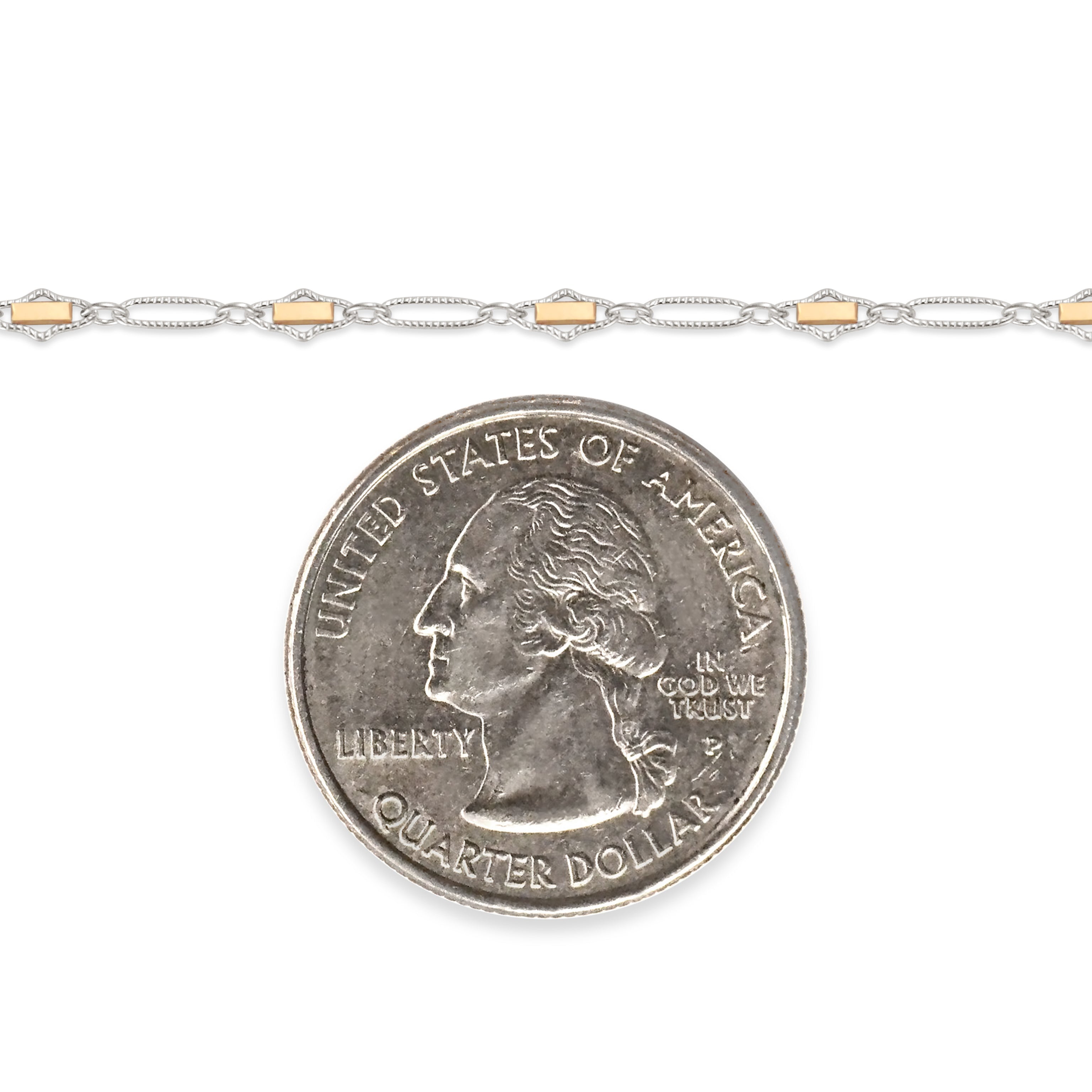 Two-tone, gold-filled and sterling silver chain next to a quarter on a white background