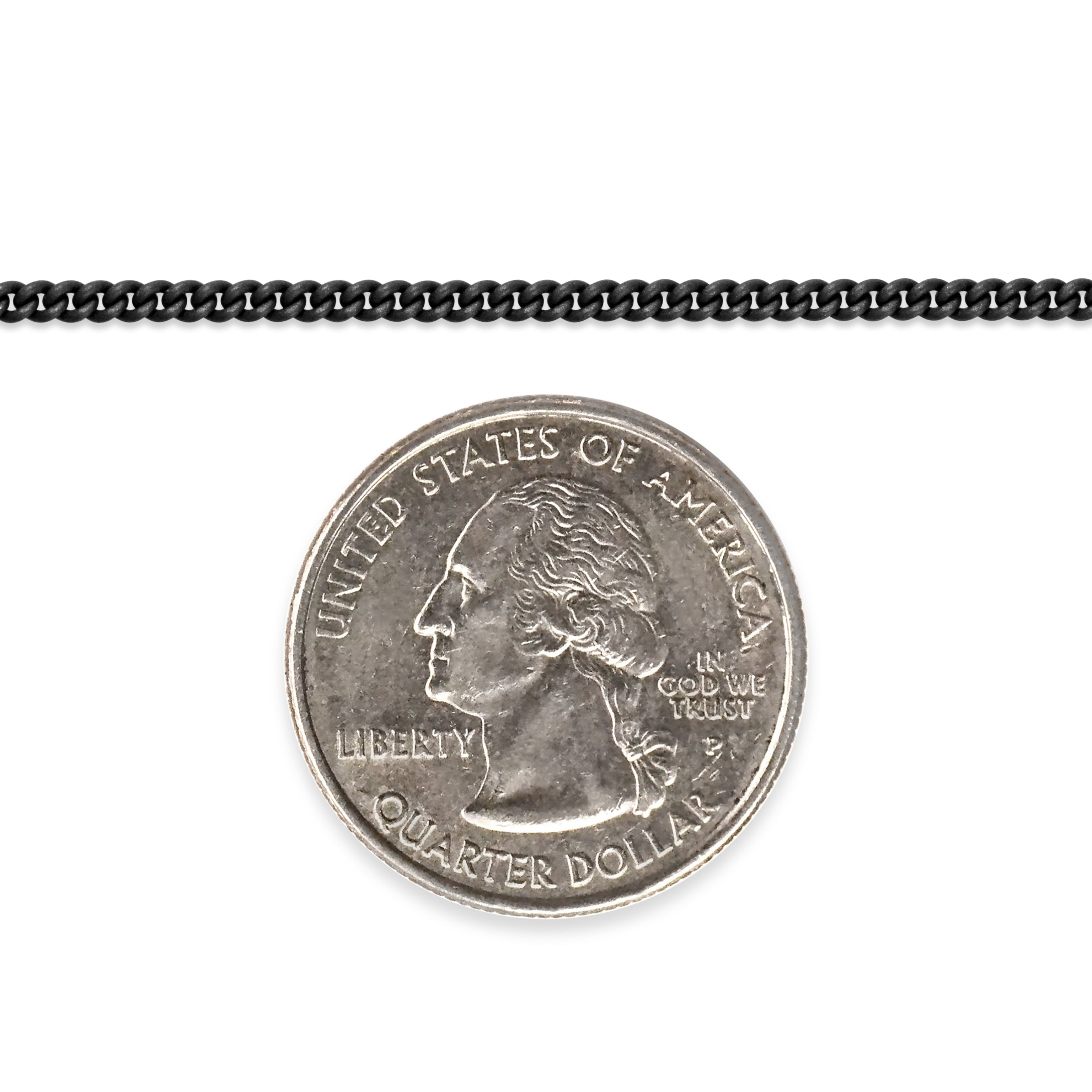 Sterling silver titanium plated chain next to a quarter dollar coin on a white background