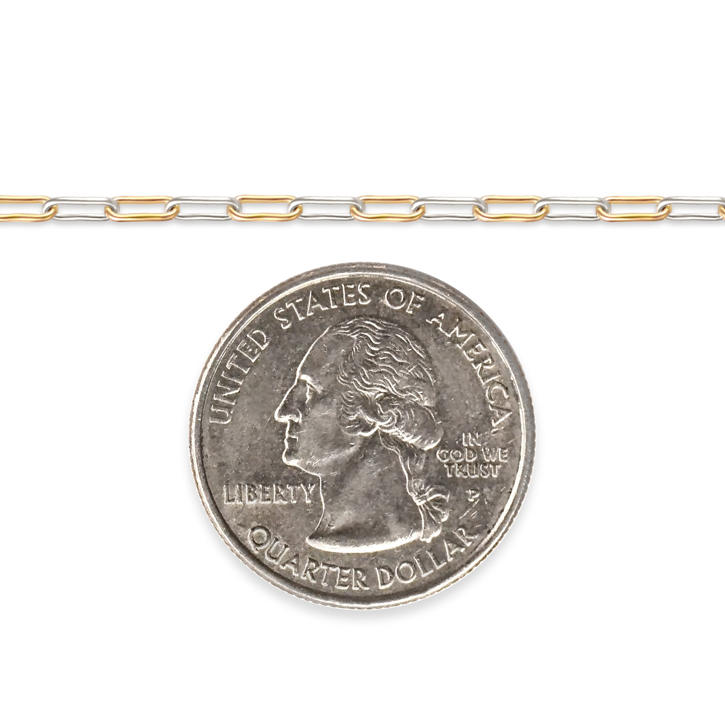 Mixed-metal, gold-filled and sterling silver chain next to a quarter on a white background