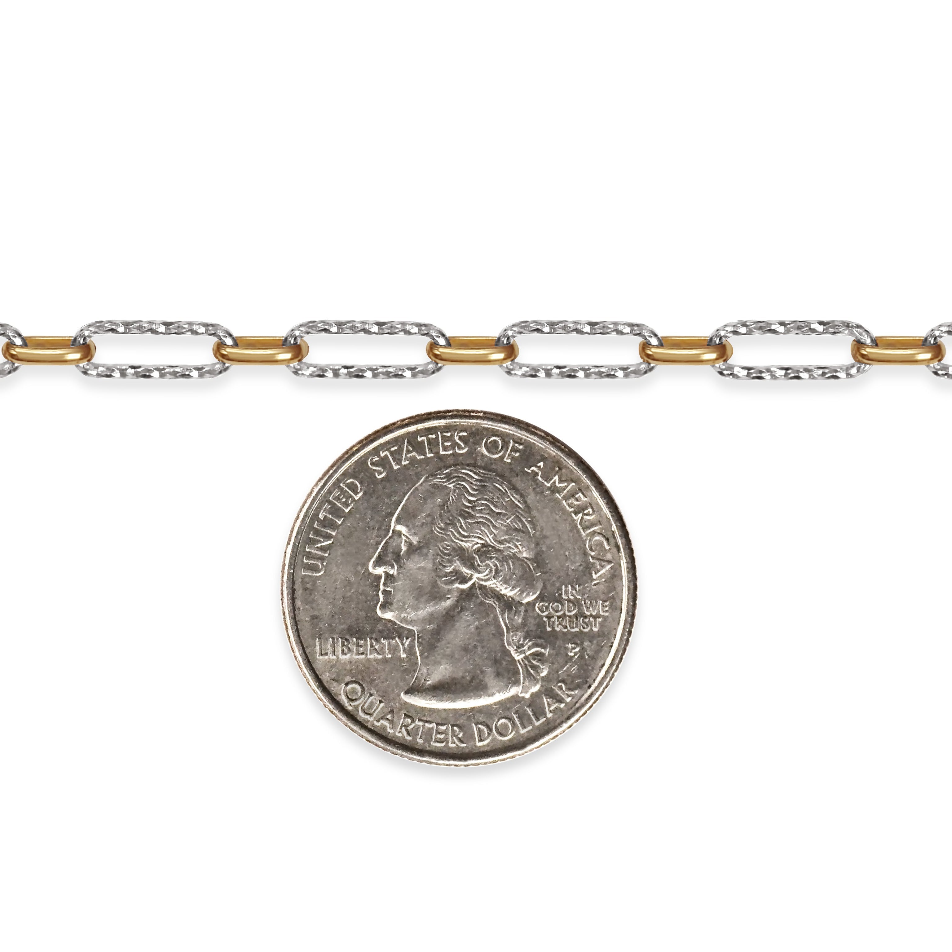 Two-tone chain next to a quarter on a white background