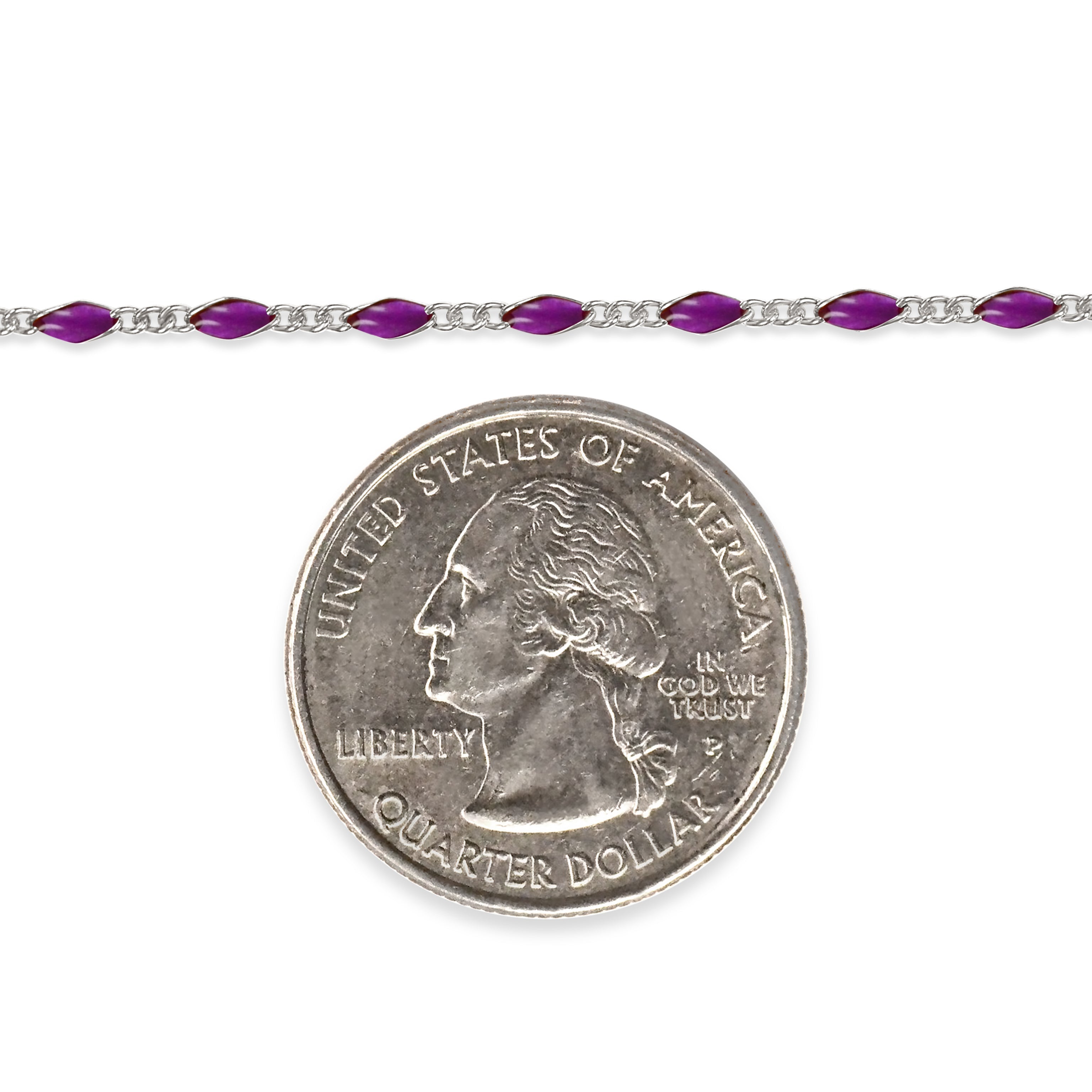 Sterling silver chain with purple enamel next to a quarter dollar coin on a white background