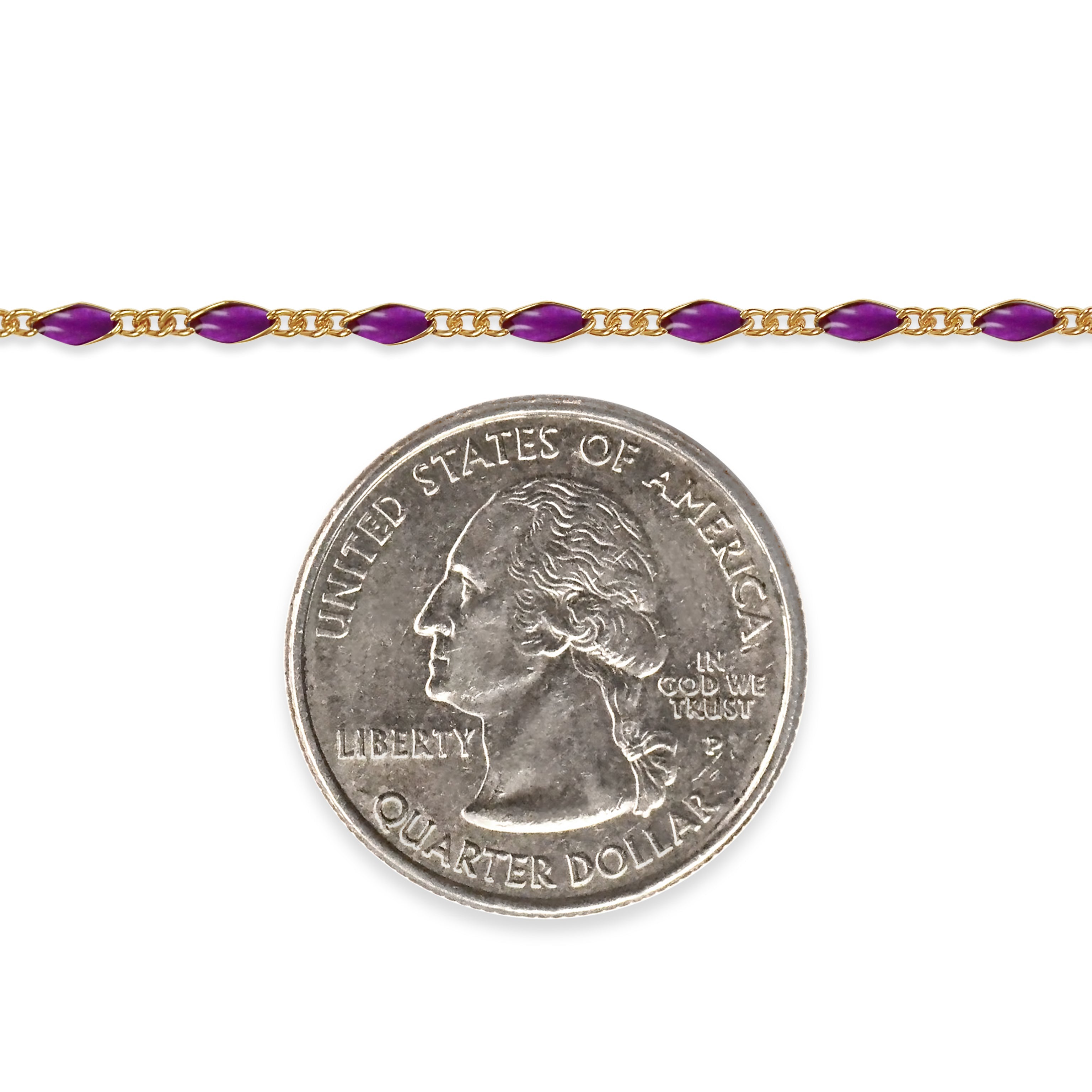 Gold filled chain with purple enamel and a quarter coin underneath on a white background