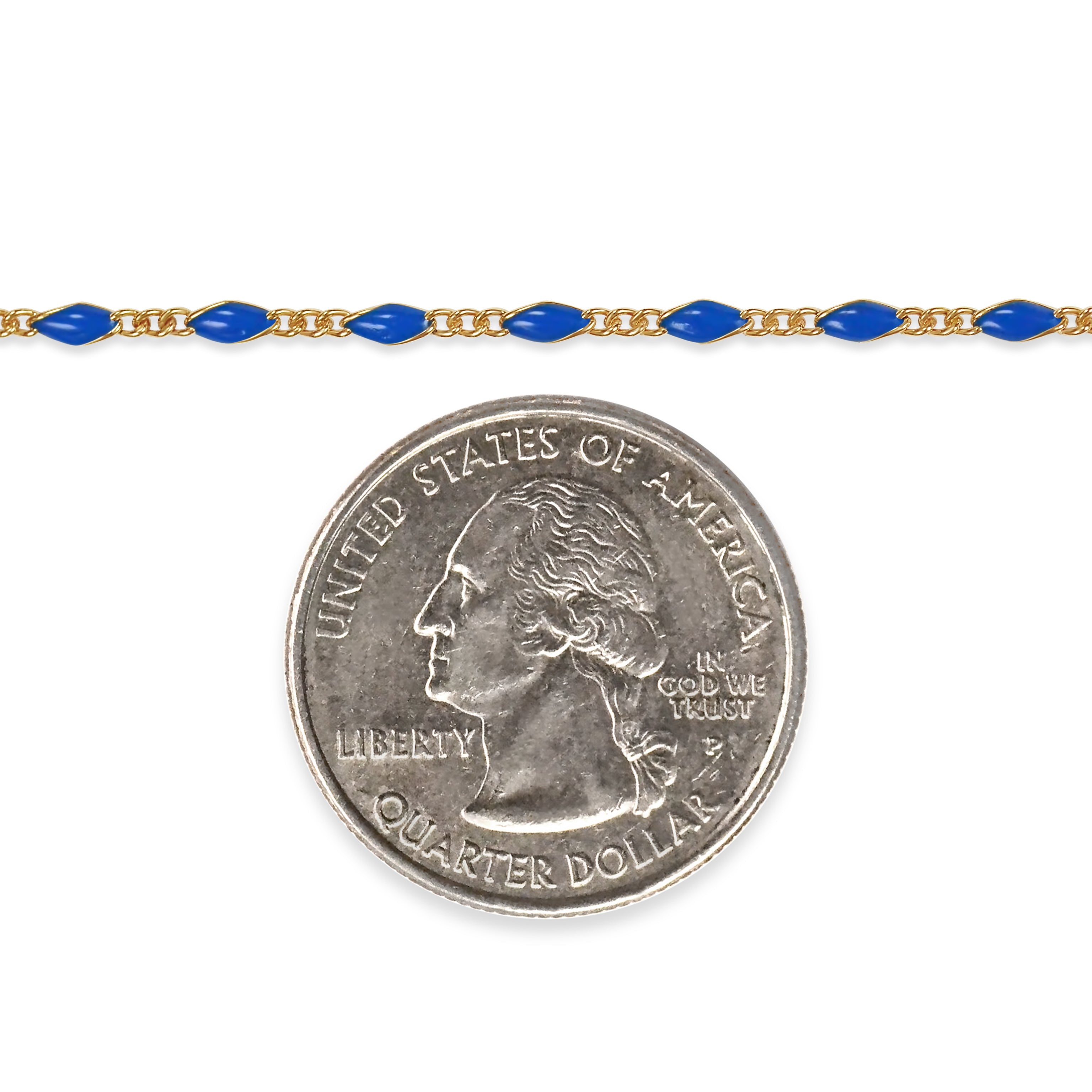 Gold filled chain with blue enamel and a quarter dollar coin on a white background