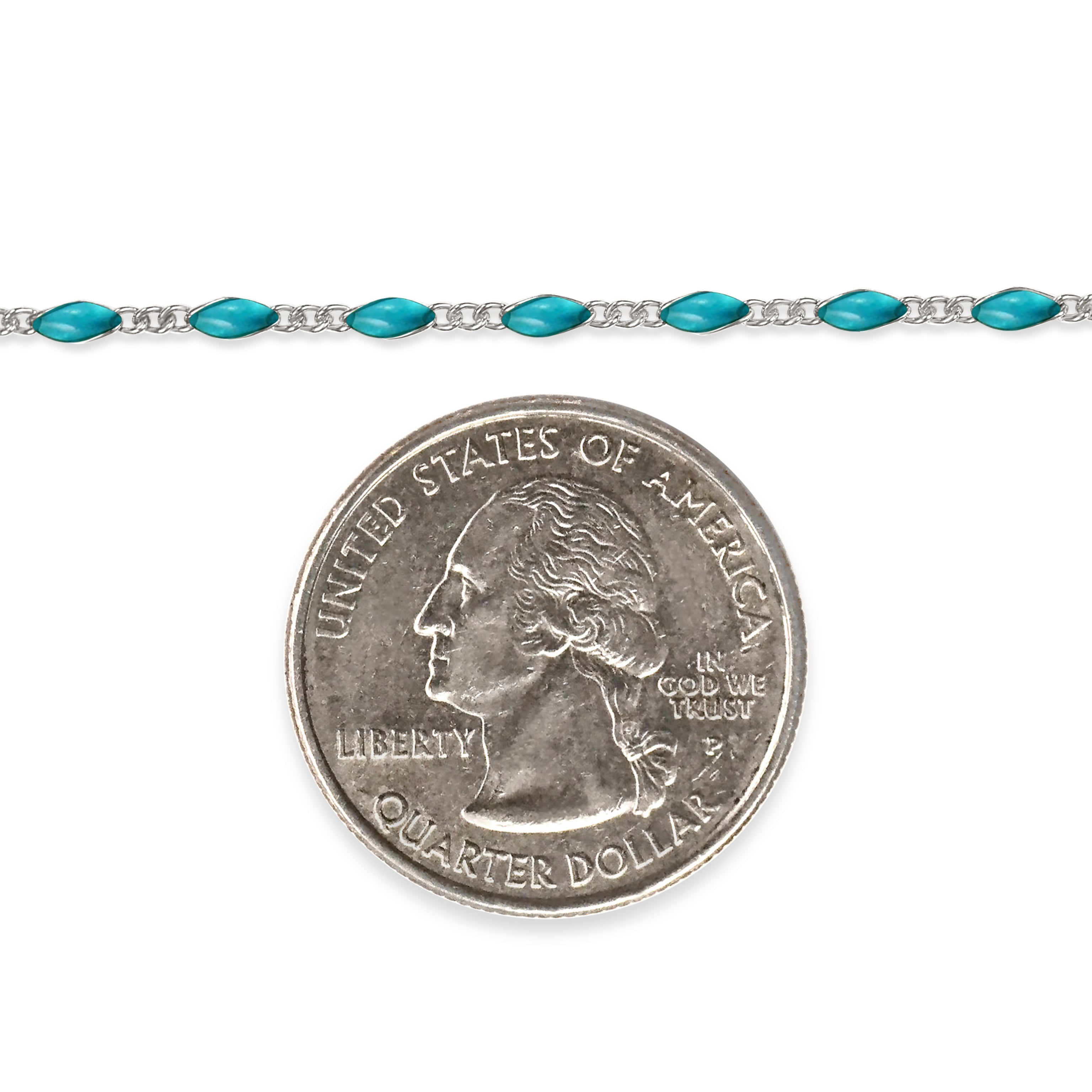 Sterling silver chain with sky blue enamel next to a quarter dollar coin on a white background