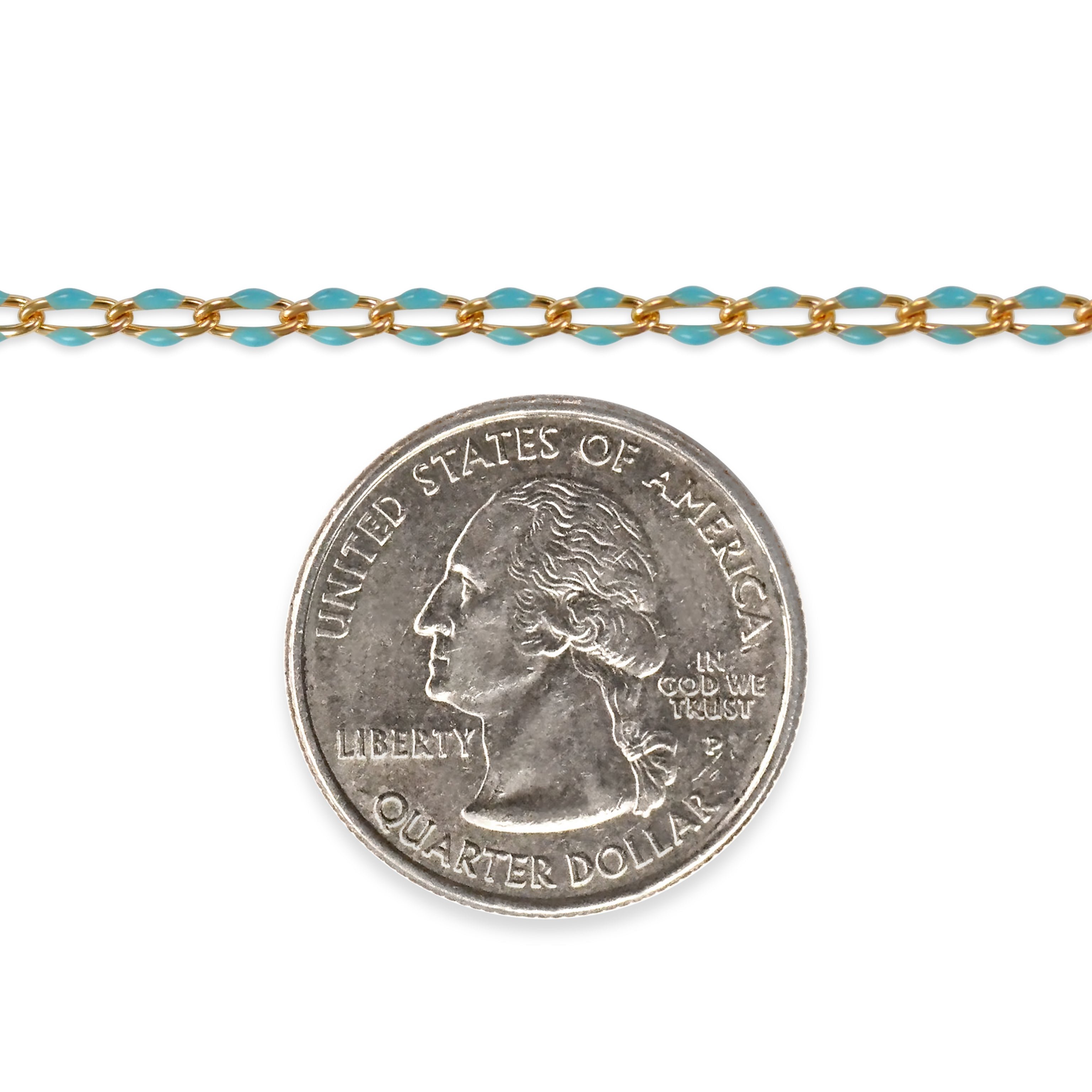 Gold filled chain with blue enamel next to a quarter dollar coin on a white background