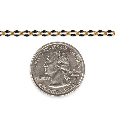 Gold filled chain with black enamel next to a quarter on a white background