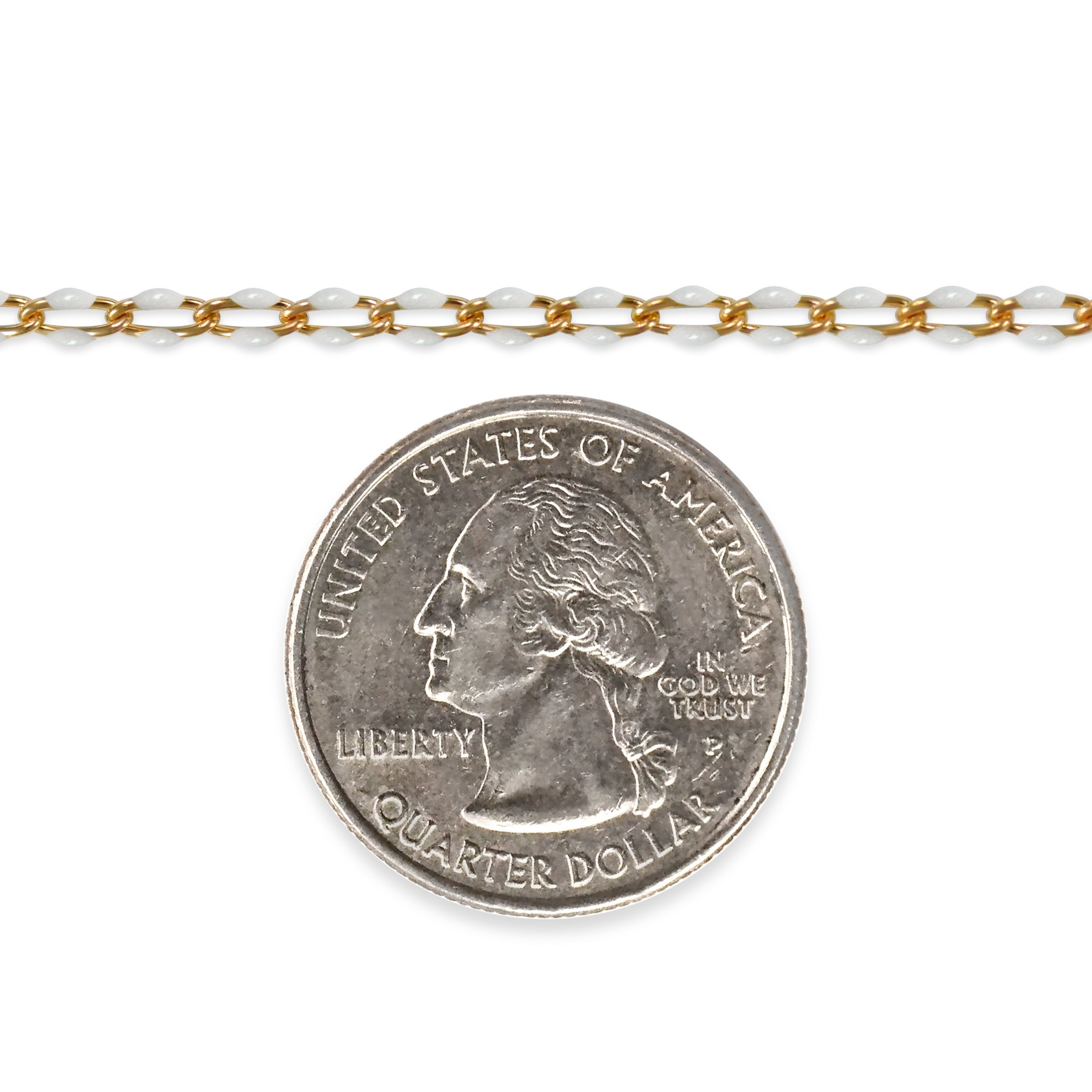 Gold filled chain with white enamel next to a quarter dollar coin on a white background