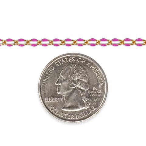 Gold filled chain with pink enamel next to a quarter on a white background