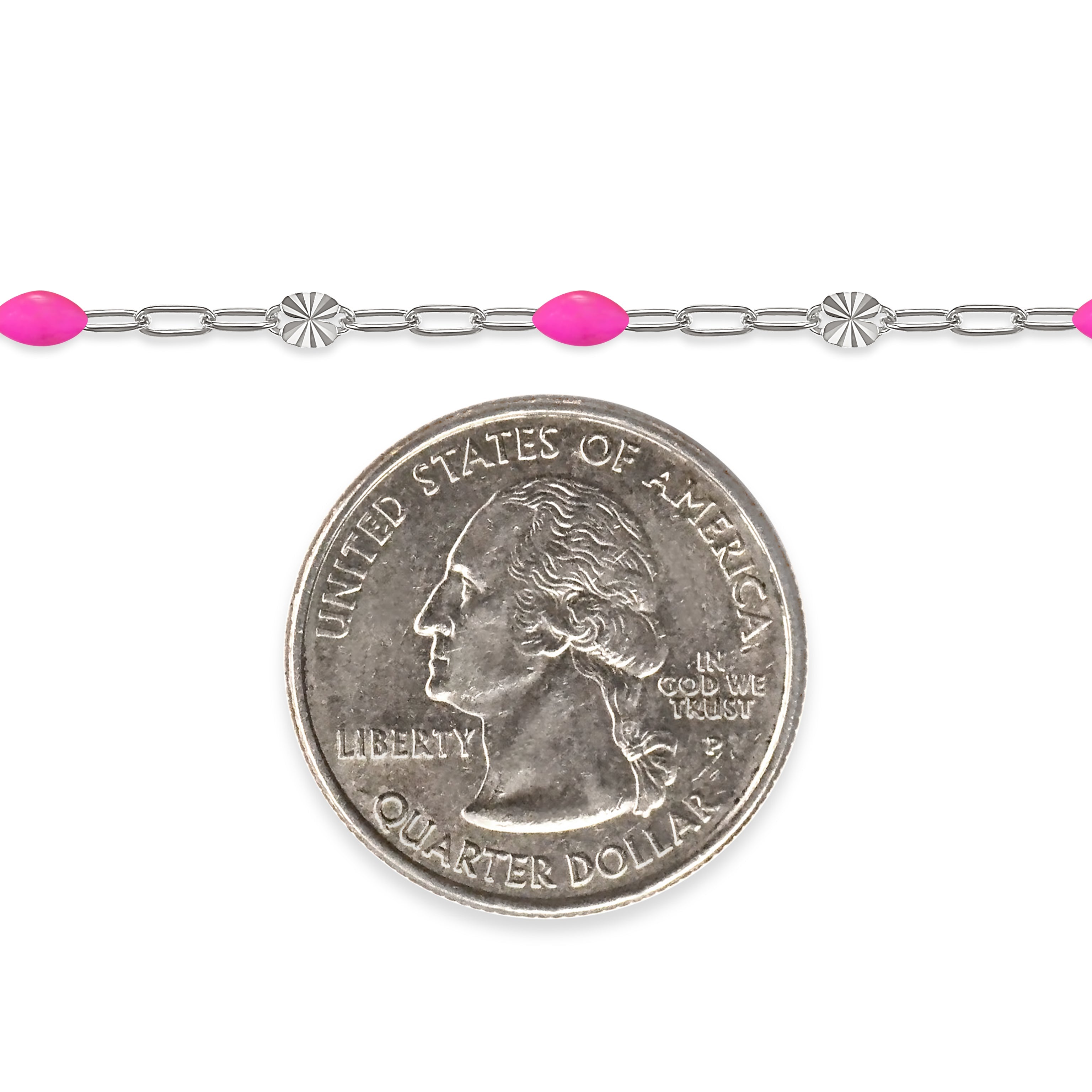 Silver chain with pink enamel next to a quarter on a white background