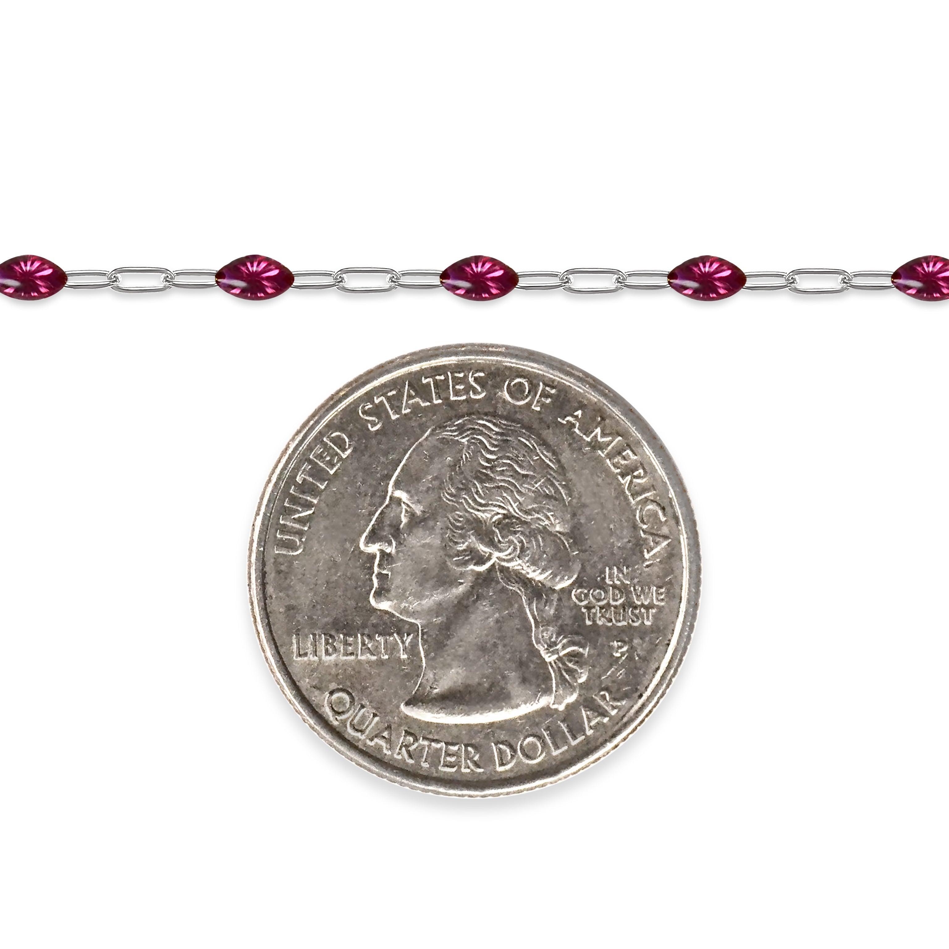 Silver chain with fuchsia colored enamel next to a quarter for scale on a white background
