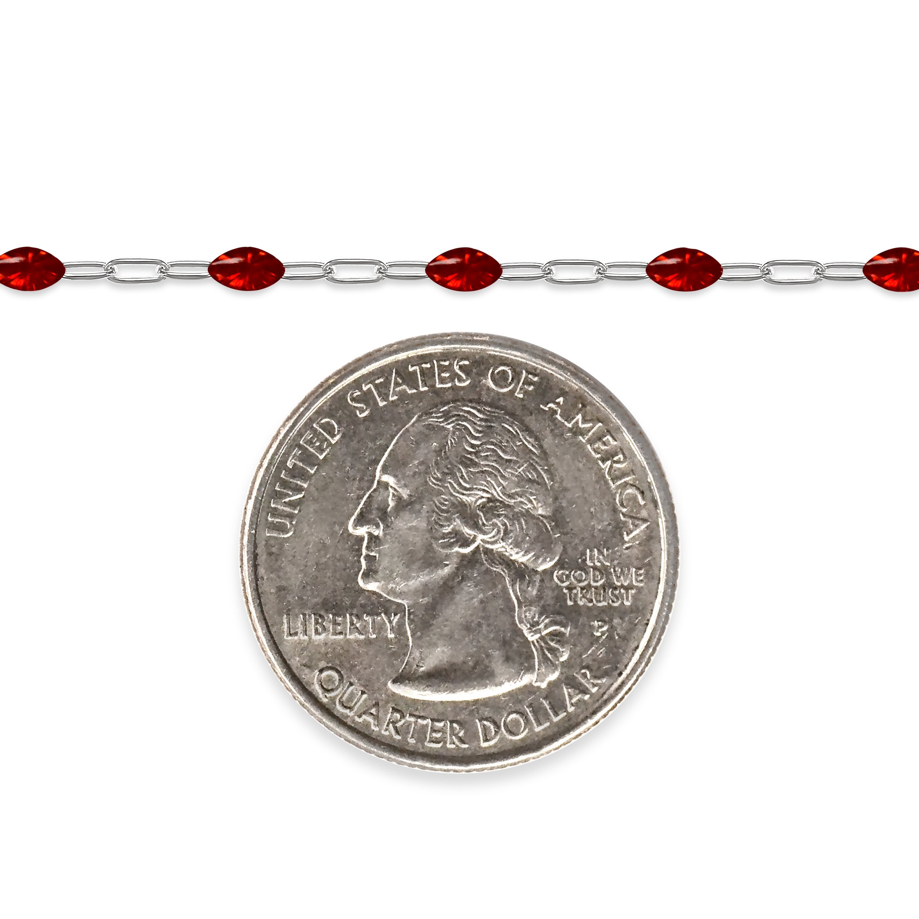 Silver chain with red enamel next to a quarter for scale on a white background
